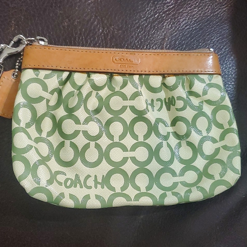 Green Coach wristlet. Never was used.  Pair with the purse for a discount.